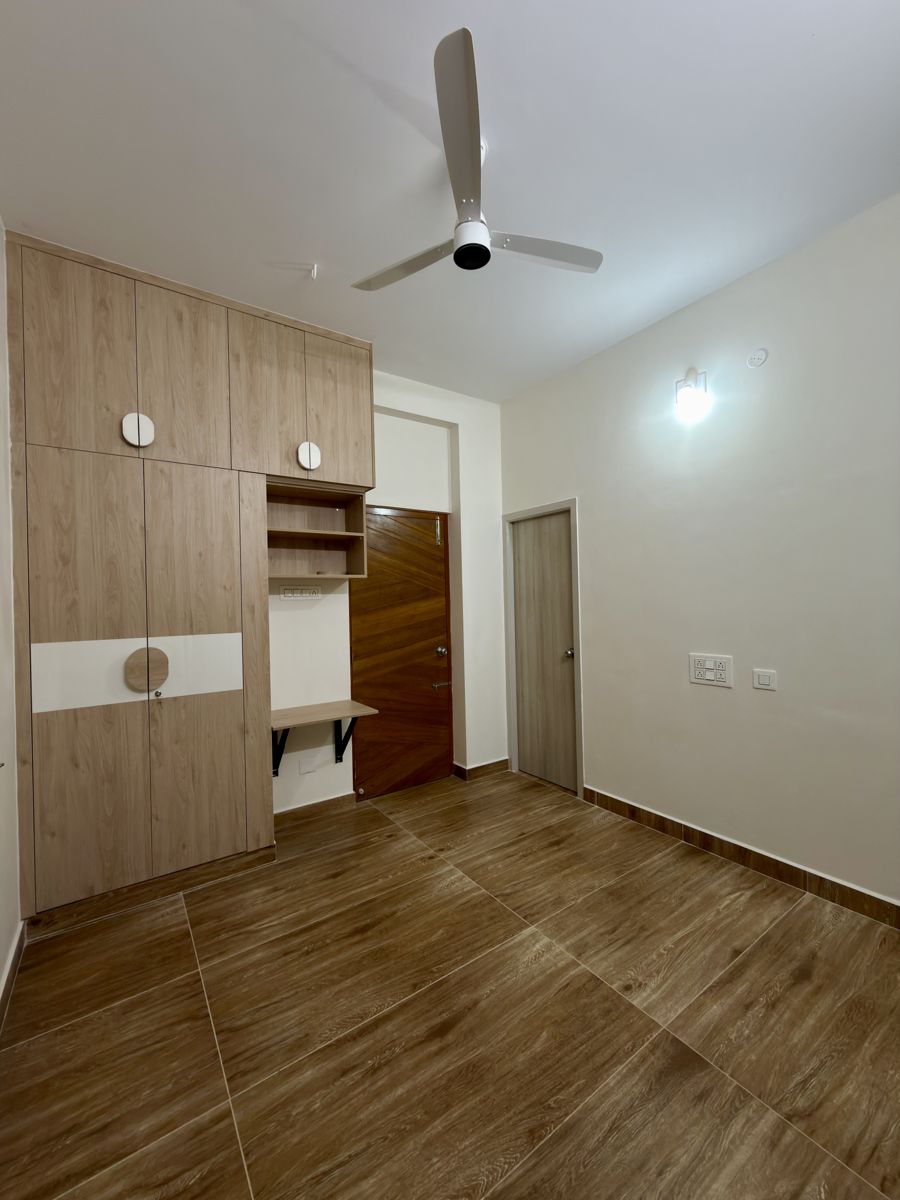 Master bedroom with full-height wardrobe and cove lighting, Chennai