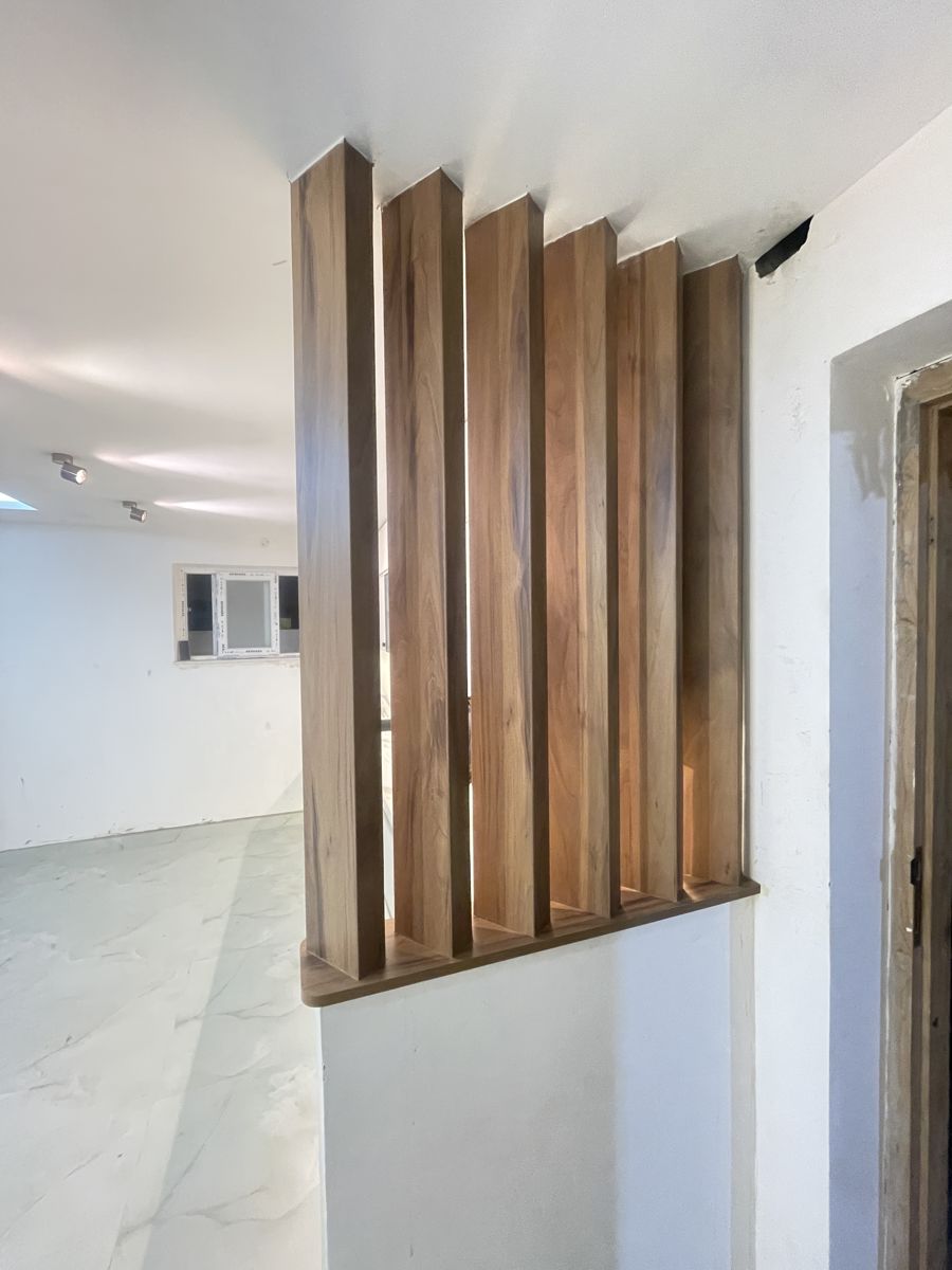 Warm wooden staircase with slatted panelling — wooden flooring in Chennai