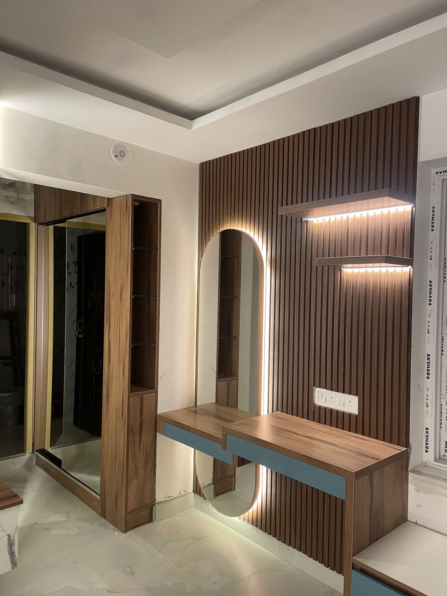 False ceiling with wooden rafters and warm lighting in a Chennai home