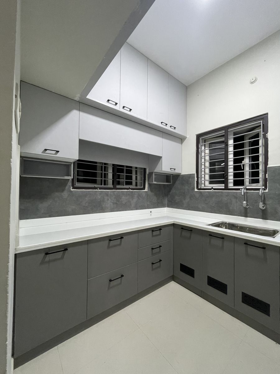 Grey and white L-shaped modular kitchen, Chennai