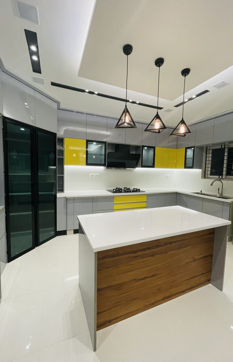 Modern island kitchen with designer pendant lights, Chennai