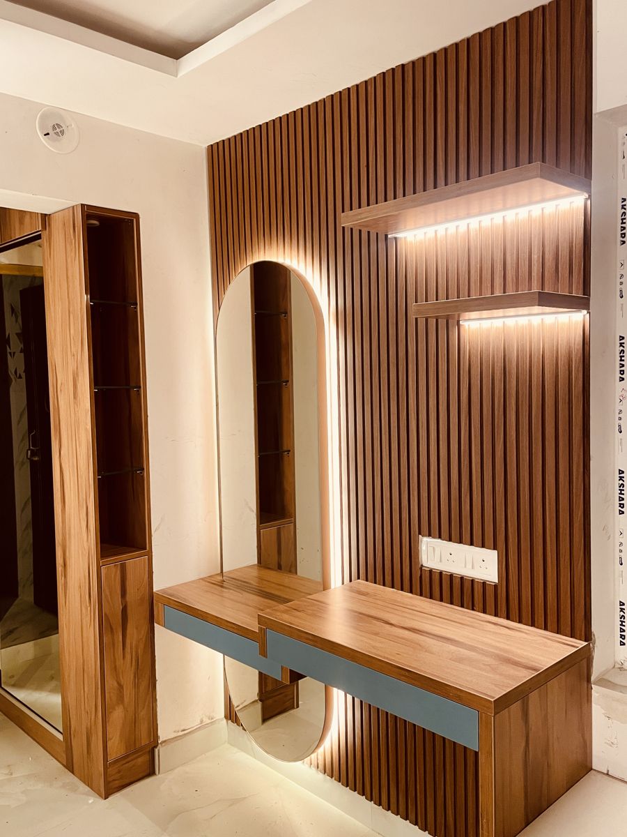 Feature wall with designer panelling and dressing unit in a Chennai bedroom