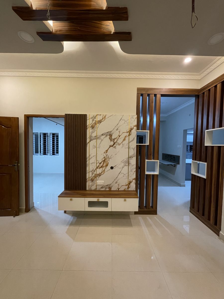 Marble-finish TV unit with wooden slat panelling, Chennai