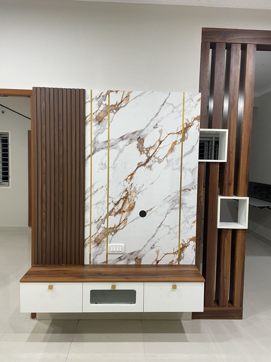Marble and wood combination TV unit in a living room, Chennai