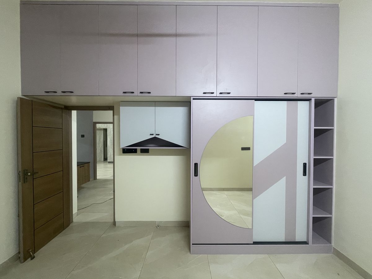 Rose-toned sliding wardrobe in a bedroom, Chennai