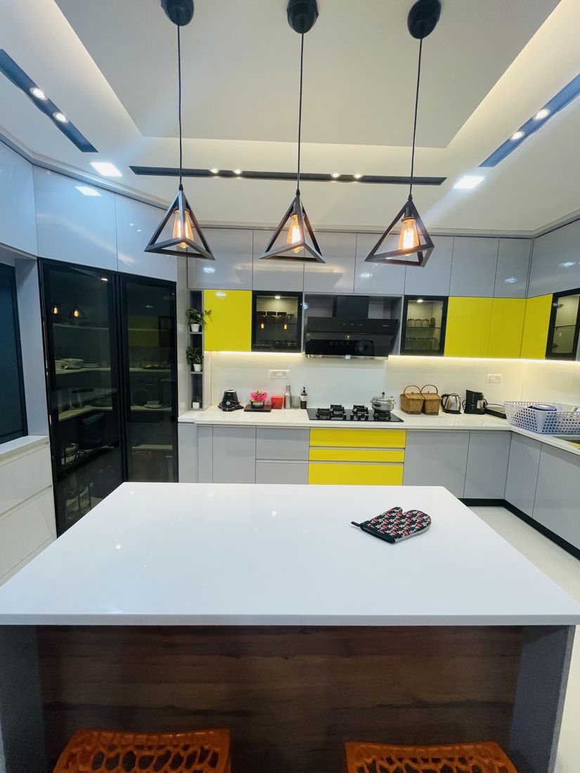 Island kitchen with yellow accents in a Chennai home