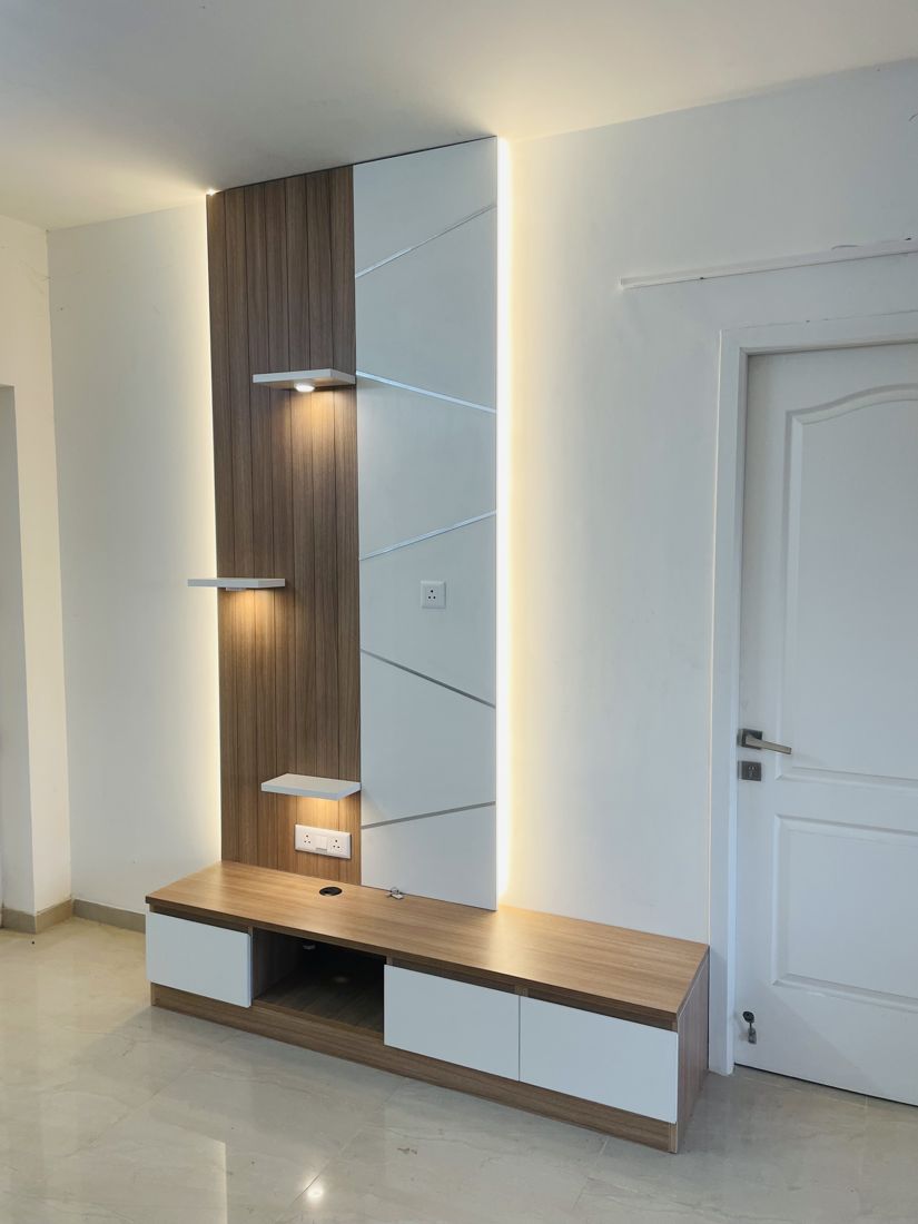 Floating TV console with mirror panel in a Thazhambur home, Chennai